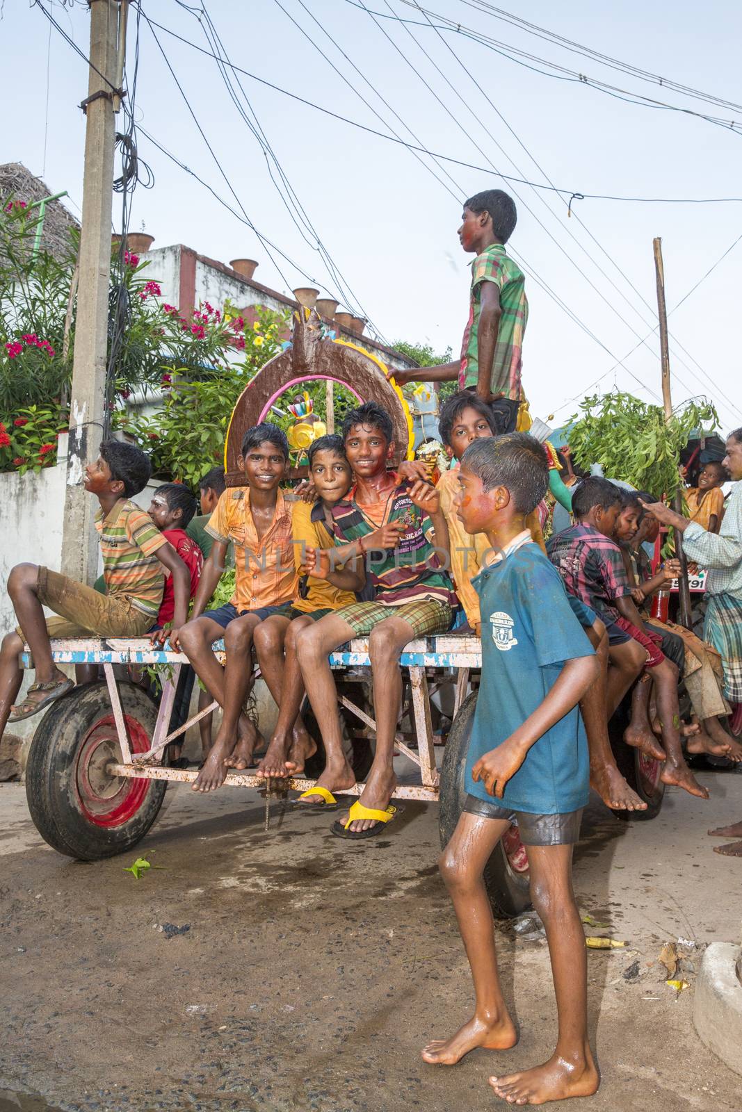 Pondicherry, Tamil Nadu,India - May 15, 2014 : each year in villages, people celebrate the temple fest, for the full day. They walk in groups, they launch paint on people, play music.