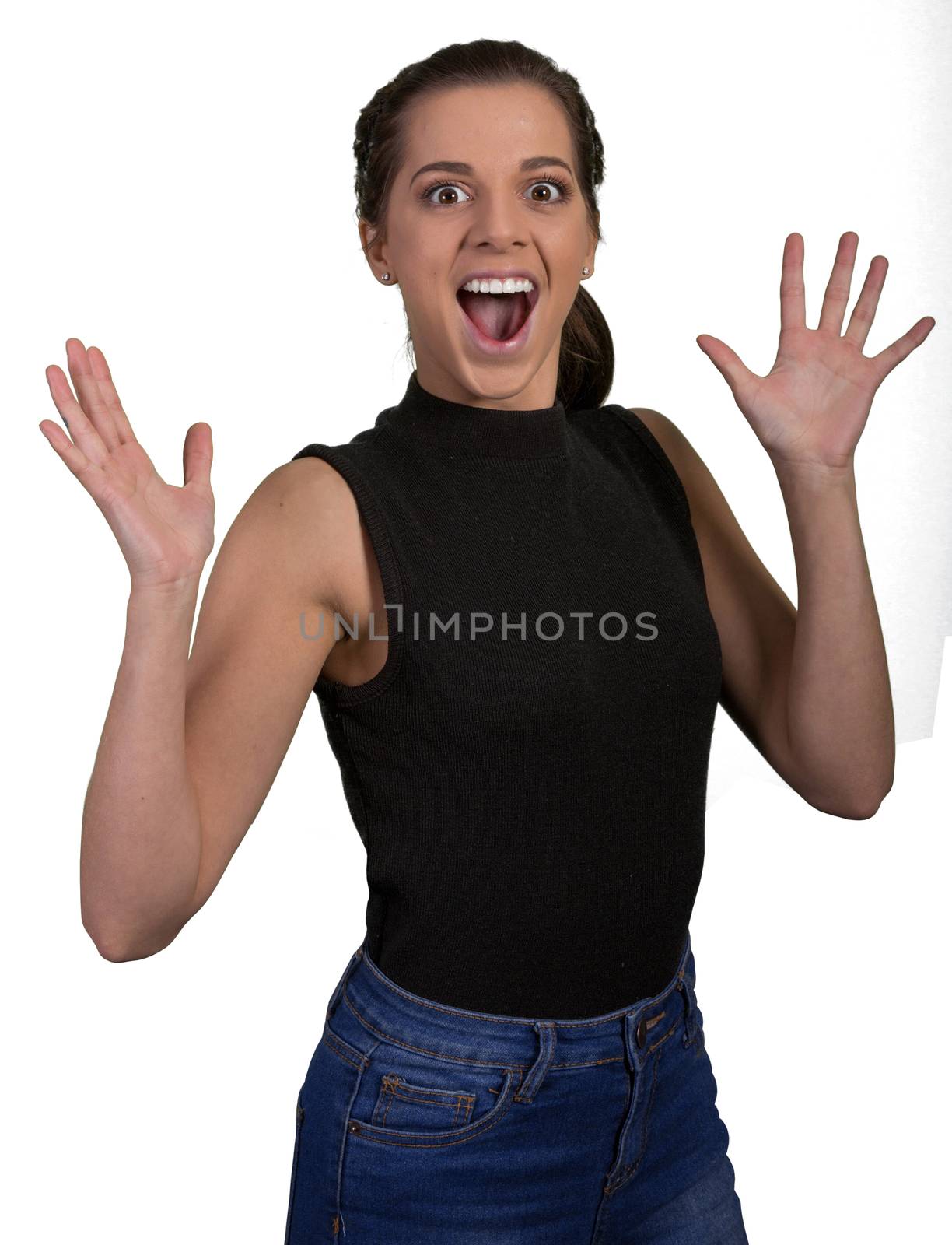 Pretty young lady with excited expression and hands out stretched