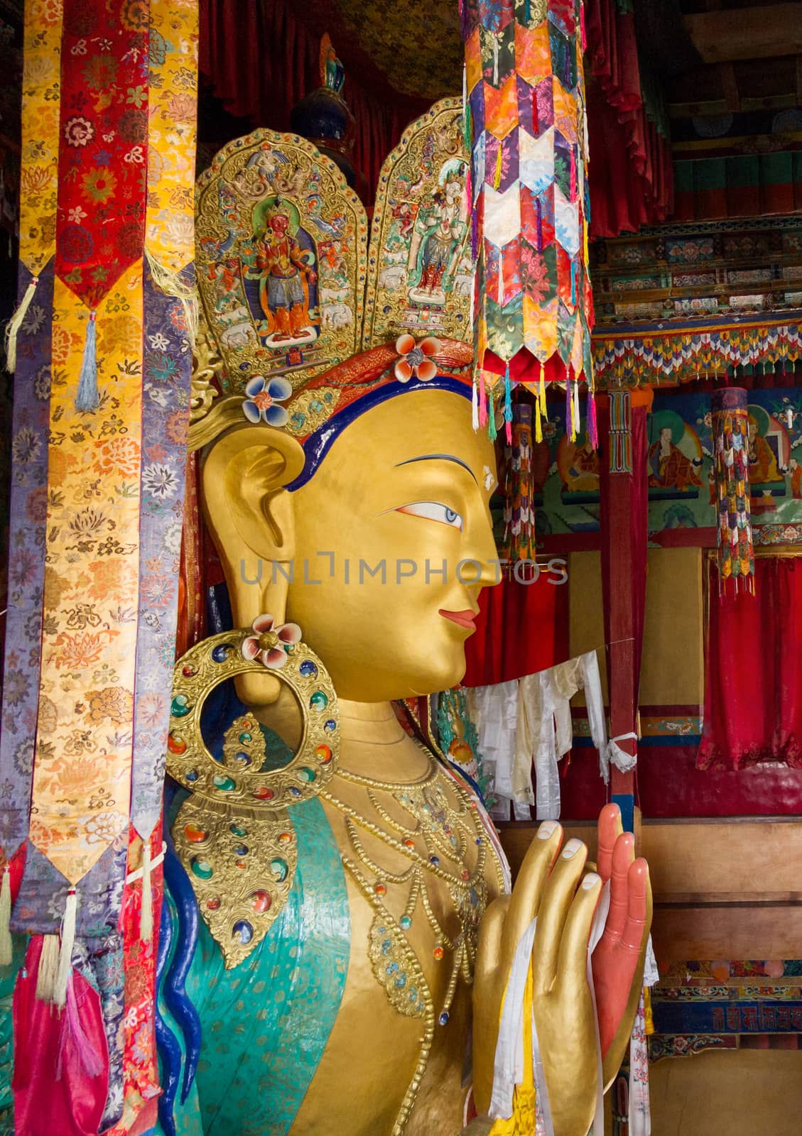 Upper part of the Giant statue of Maitreya Buddha (the largest statue in Ladakh, which occupies two floors of the building) in the Thikse Monastery near Leh (Ladakh, Jammu and Kashmir, north India)