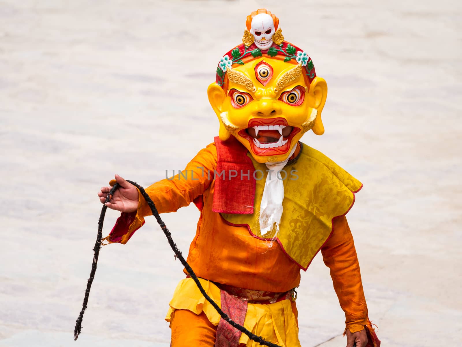 Hemis, India - June 29, 2012: unidentified monk performs a religious masked and costumed mystery dance of Tibetan Buddhism during the Cham Dance Festival in Hemis monastery, India.