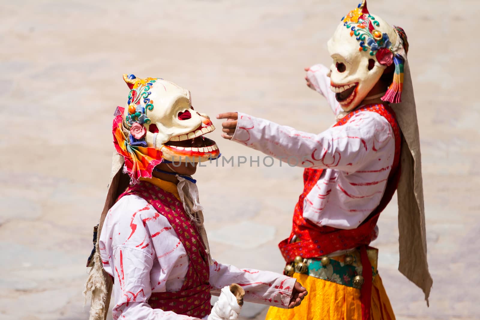 Monks performs a religious masked and costumed mystery dance of Tibetan Buddhism during the Cham Dance Festival by straannick