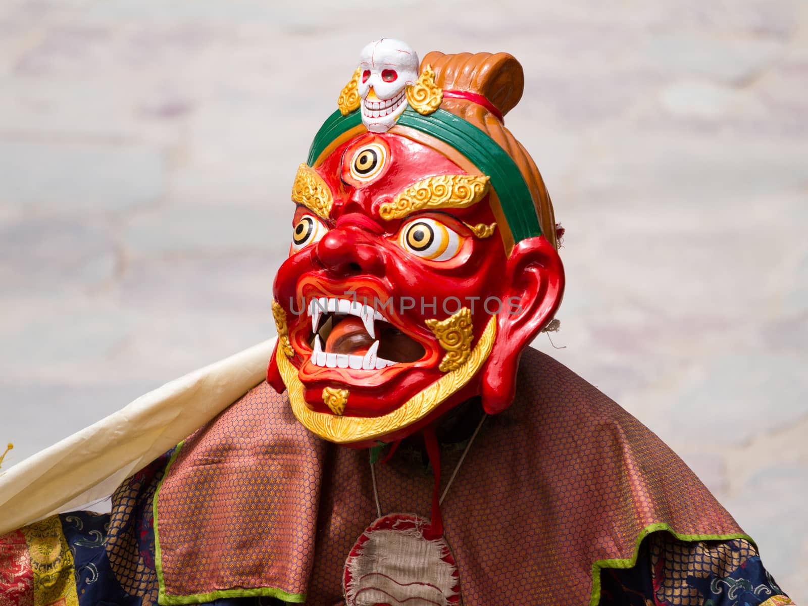 Unidentified monk performs a religious masked and costumed mystery dance of Tibetan Buddhism during the Cham Dance Festival in Hemis monastery, India.