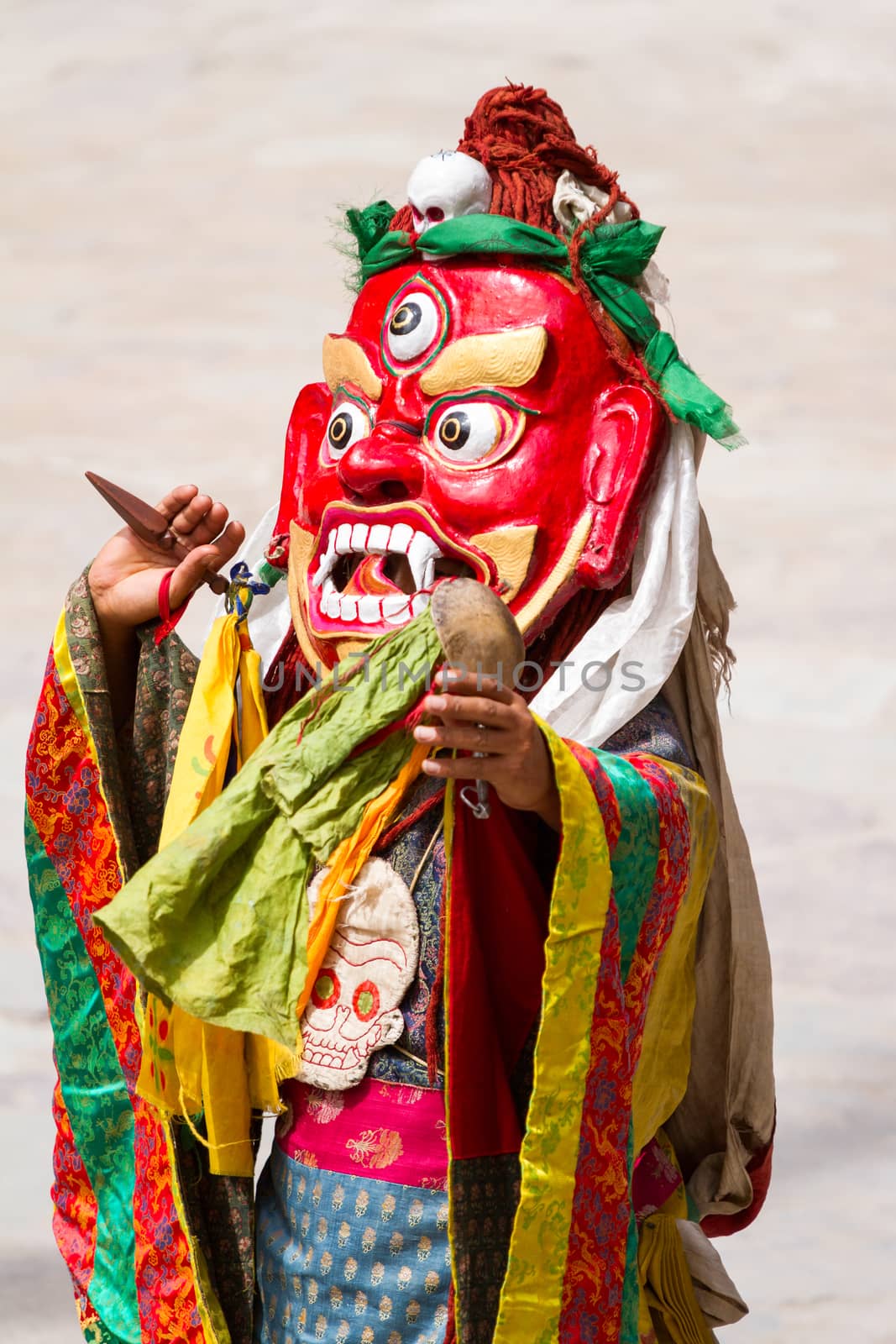 Unidentified monk with phurpa (ritual knife) performs a religious masked and costumed mystery dance of Tibetan Buddhism during the Cham Dance Festival in Hemis monastery, India.