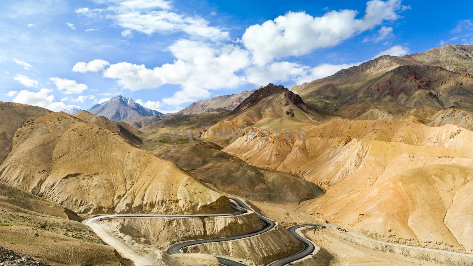 The new winding road in the Himalayas mountains by straannick