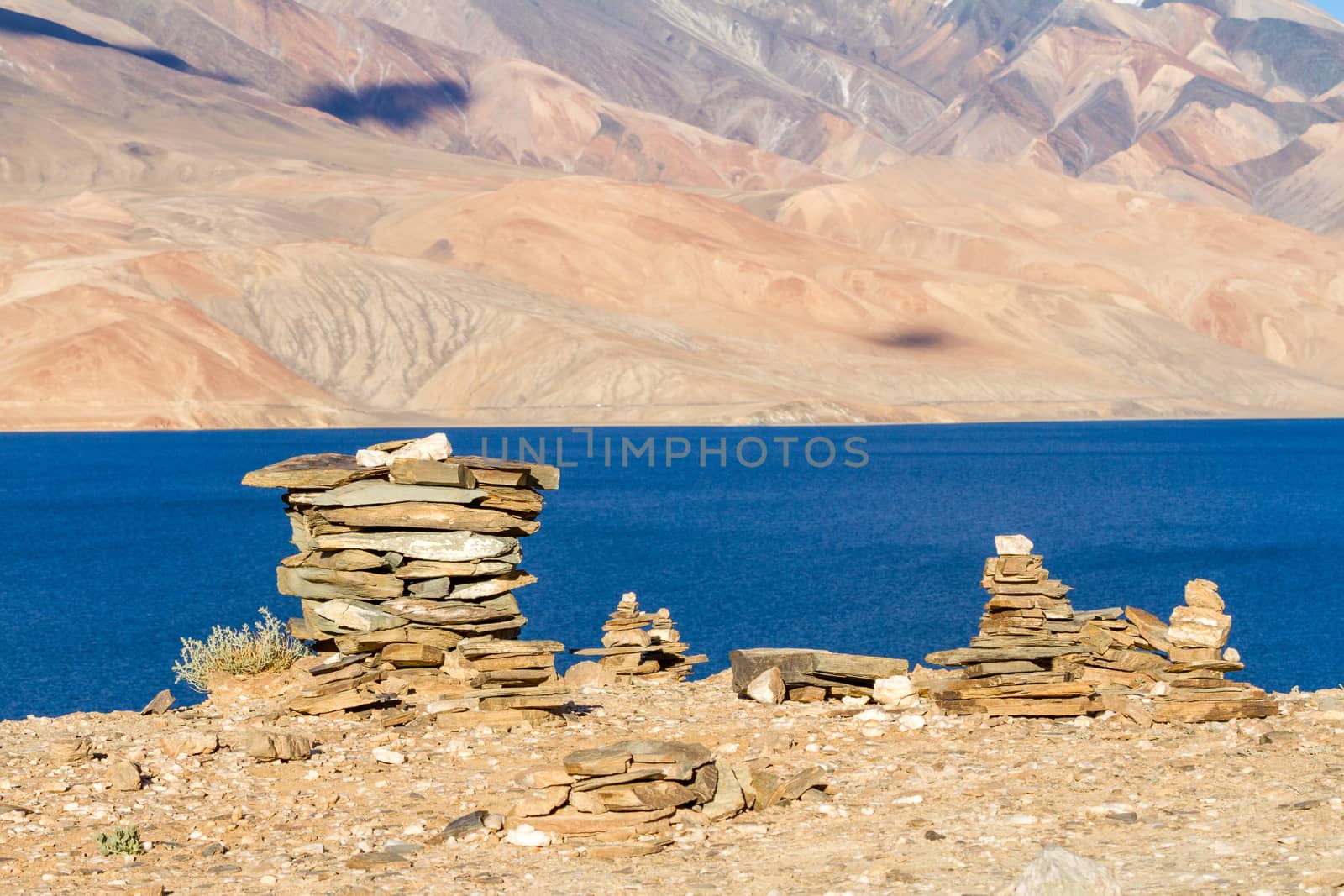 Small Buddhist stupas, collected in the form of a stack of zen stones in the lake Tso Moriri surroundings by straannick