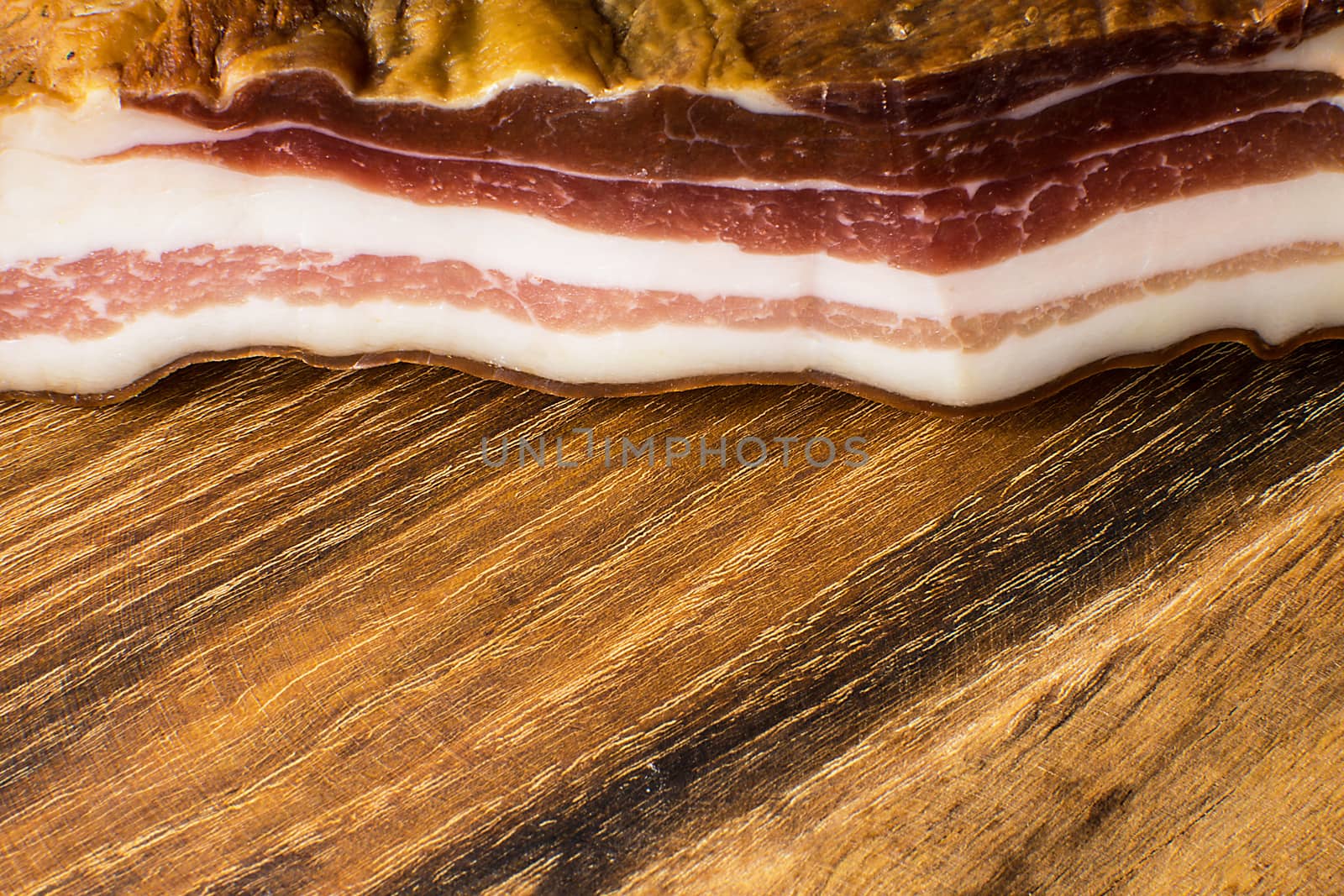 Smoked Bacon on Vintage Wooden Board by Victority