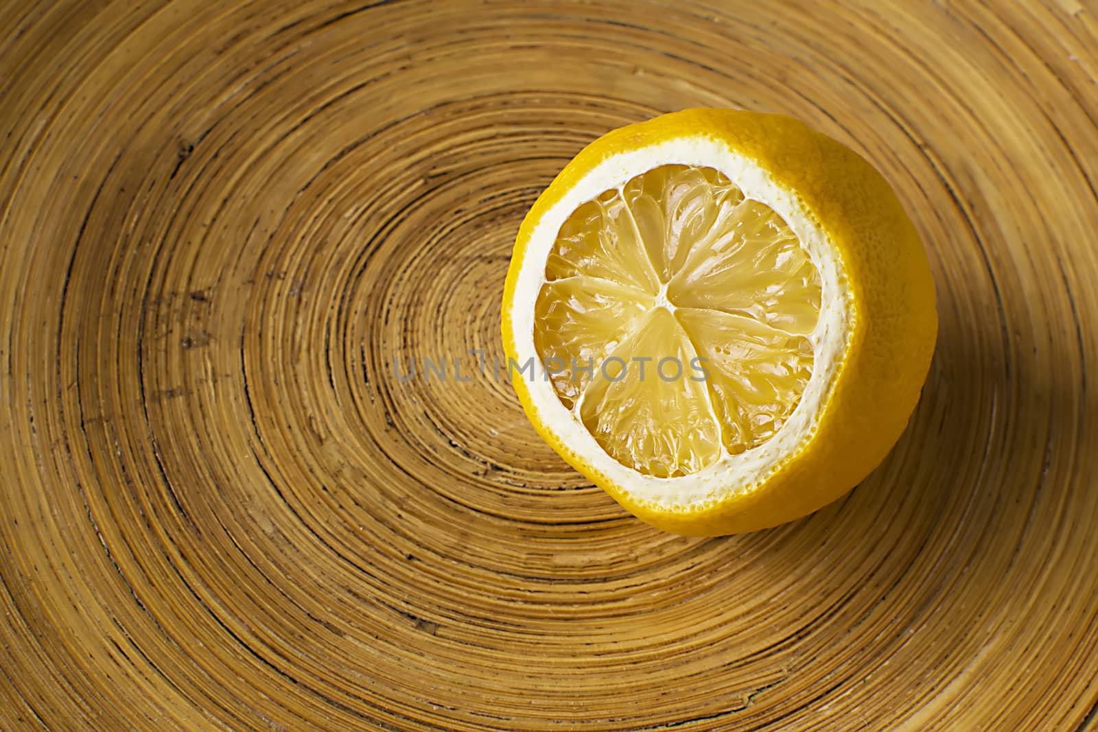 Mild Dried Lemon in a Wooden Bowl by Victority