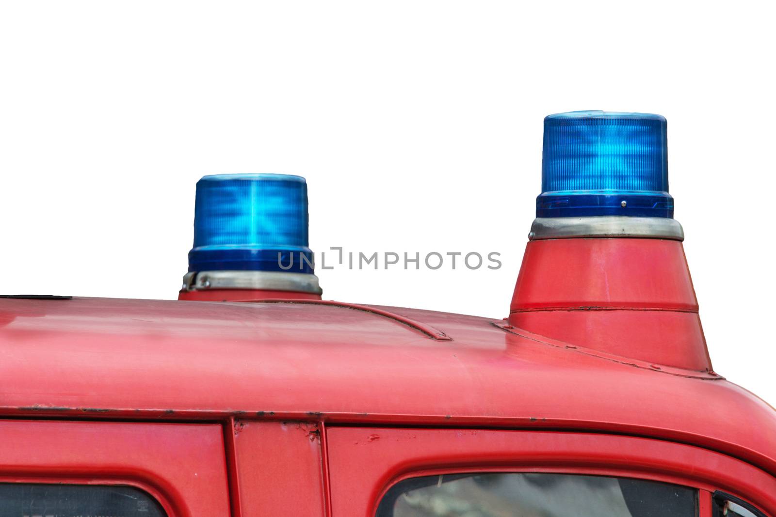 Two flashing blue lights on a fire truck.