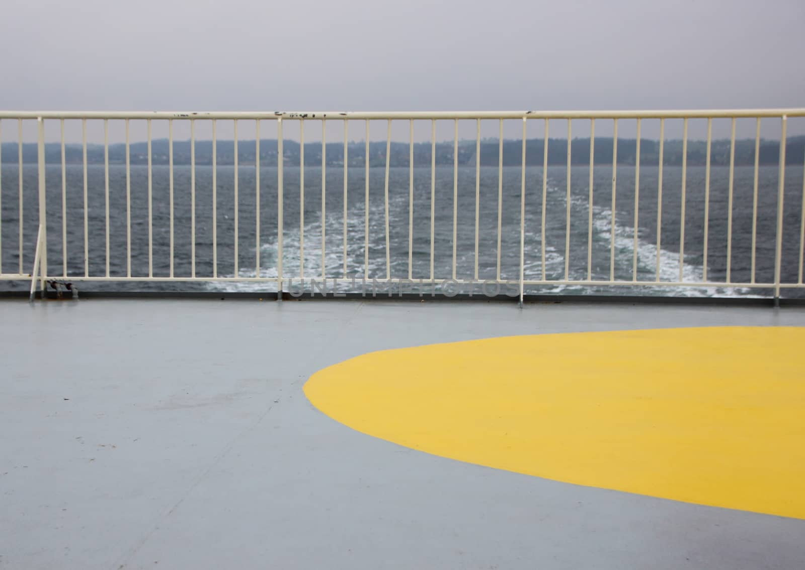 Ship Foam Trail from Ferry with Yellow Heliport Landing Marker and Railing