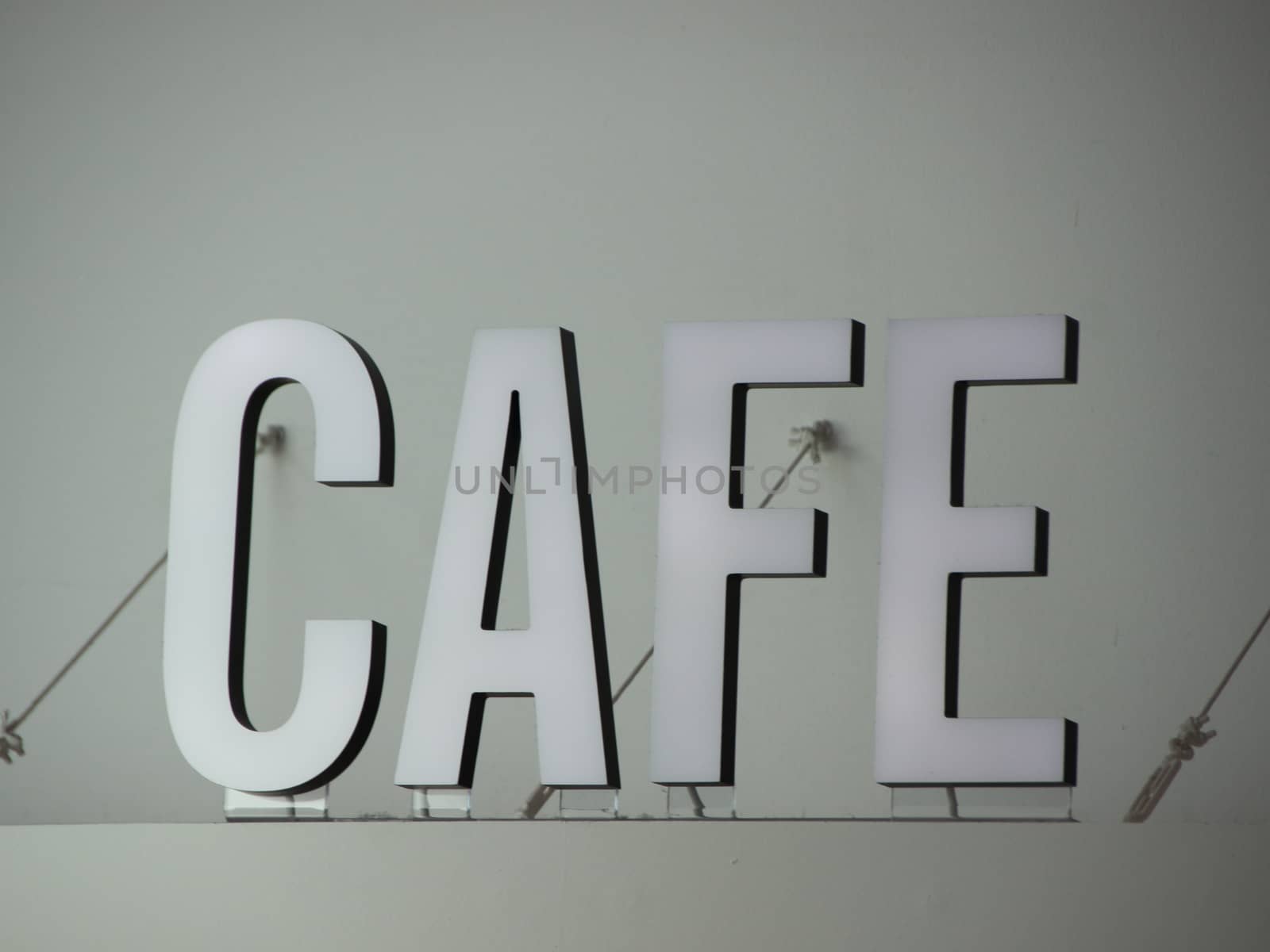 White 3D Cafe Sign Letters Mounted Secure with Wires