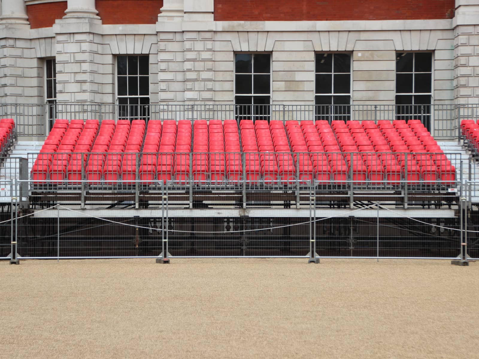 Stand Platform with Rows of Red Plastic Seats by HoleInTheBox