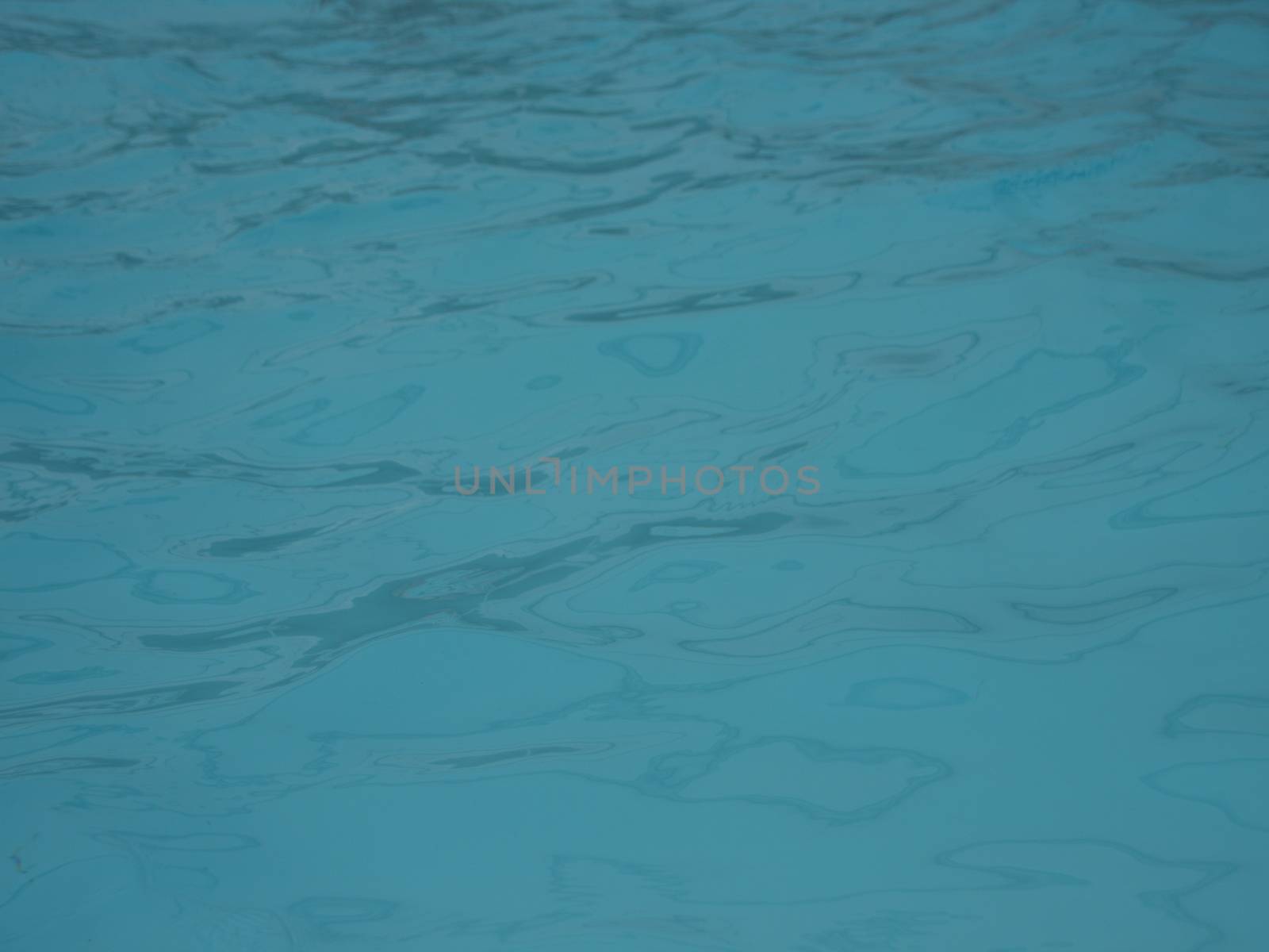 Soft Blue Meditation Water in Swimming Pool with Waves. Smooth Contrast.