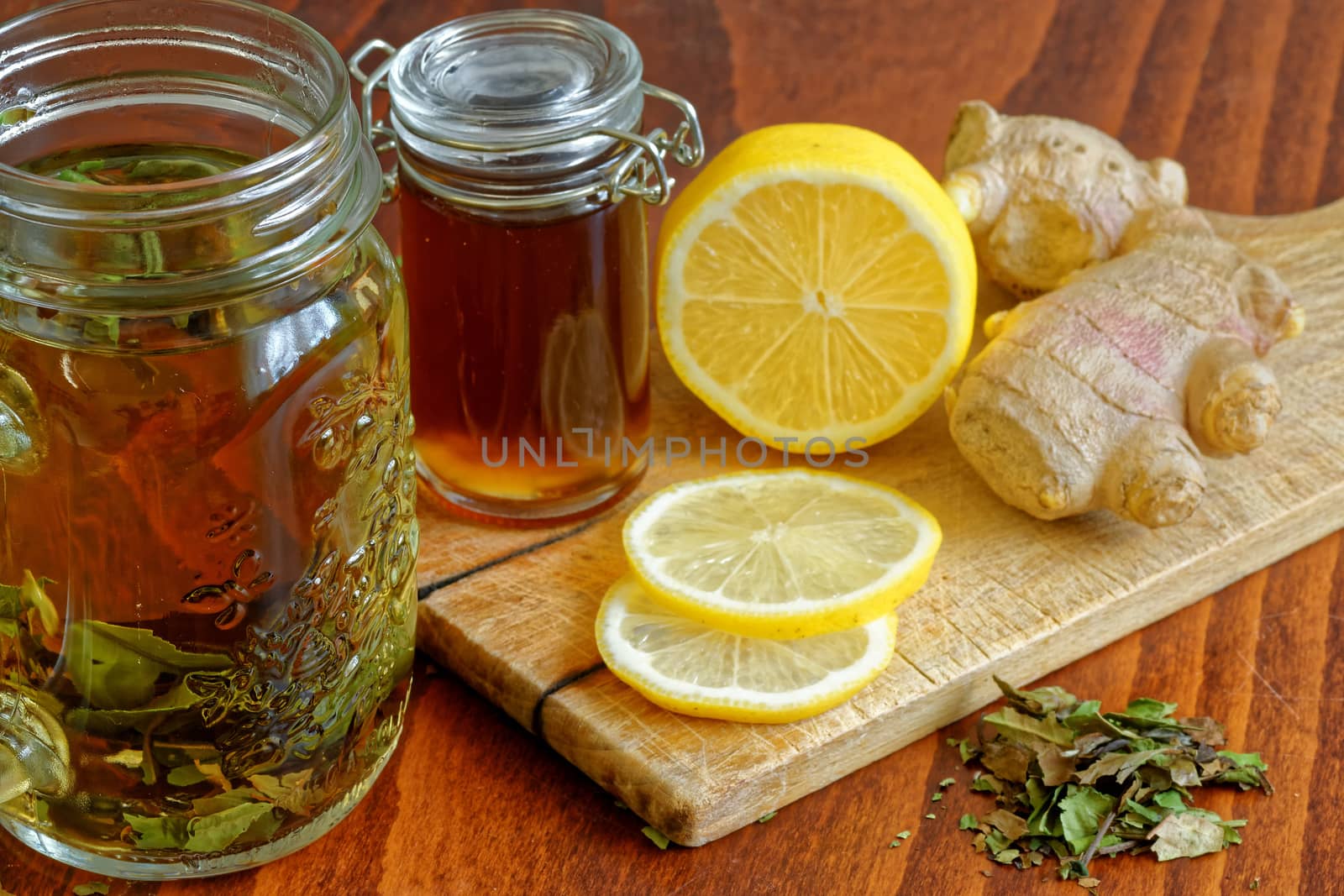 green tea in glass, lemon, brown sugar, ginger