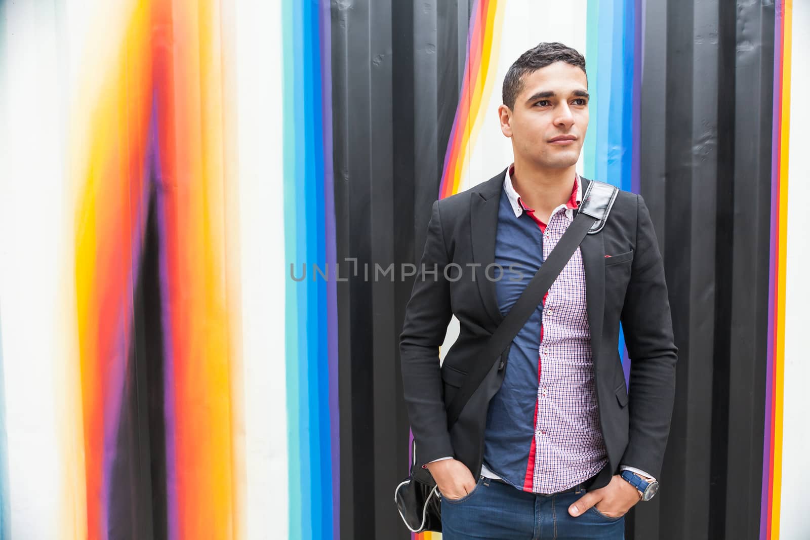 Modern young man with Arab with a bag by andongob
