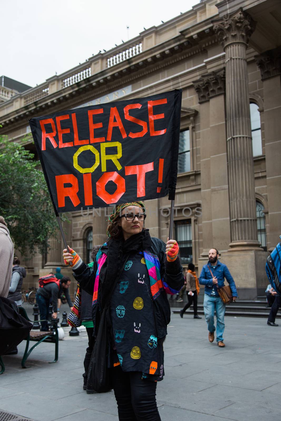 Protesters rally against the torture and detention of indigenous children in the Northern Territory. The rally was held outside the State Library.