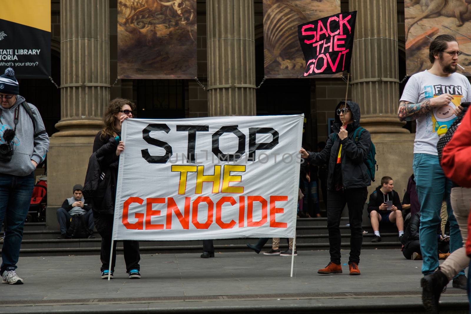 Protesters rally against the torture and detention of indigenous children in the Northern Territory. The rally was held outside the State Library.