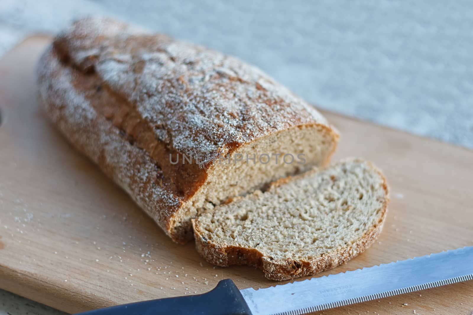 Fresh bread slice on a rustic table