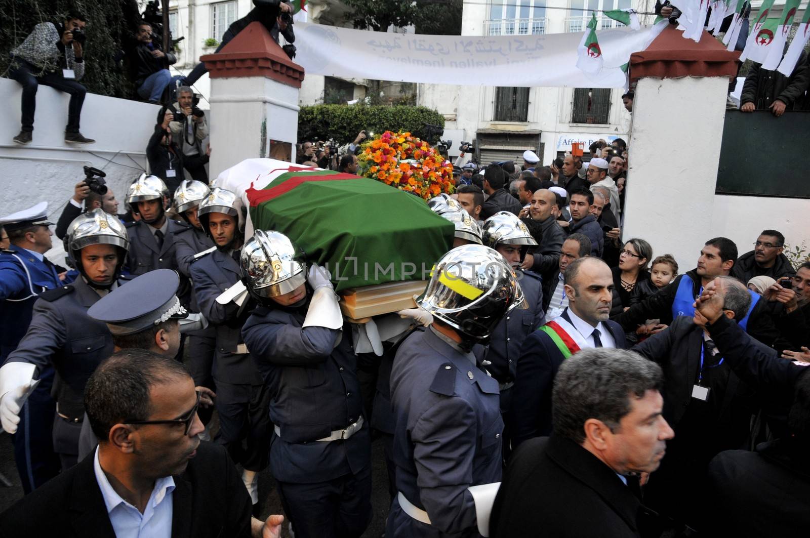 ALGERIA, Algiers : Algerians pay tribute to late Algerian opposition figure Hocine Ait-Ahmed, on December 31, 2015 in the capital Algiers after his body was brought to his homeland for a state funeral. Ait-Ahmed, one of the fathers of Algeria's struggle for independence from France and then a longtime opposition figure, died in Lausanne, Switzerland on December 23, his Socialist Forces Front party said. Ait-Ahmed, 89, was the last of the nine so-called sons of Toussaint, who launched the uprising in November 1954.