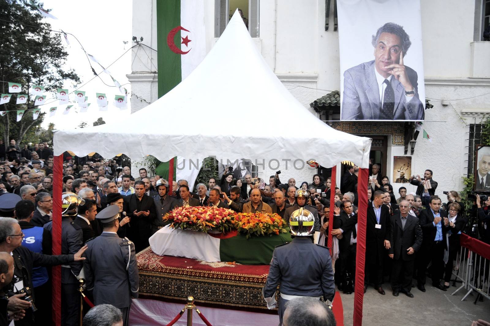 ALGERIA, Algiers : Algerians pay tribute to late Algerian opposition figure Hocine Ait-Ahmed, on December 31, 2015 in the capital Algiers after his body was brought to his homeland for a state funeral. Ait-Ahmed, one of the fathers of Algeria's struggle for independence from France and then a longtime opposition figure, died in Lausanne, Switzerland on December 23, his Socialist Forces Front party said. Ait-Ahmed, 89, was the last of the nine so-called sons of Toussaint, who launched the uprising in November 1954.