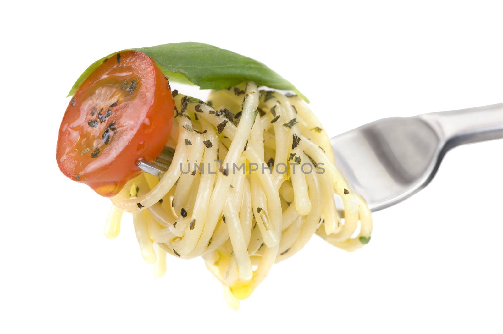 Spagetti with tomato and basil on fork, white background