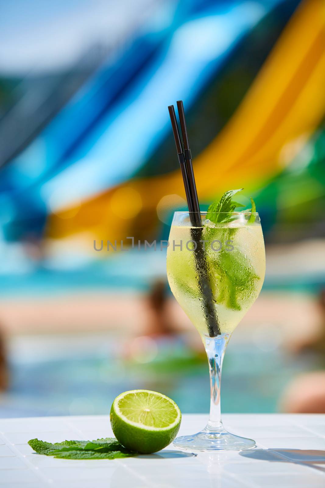 Close up Cocktail margaritas with lime near the swimming pool in hotel