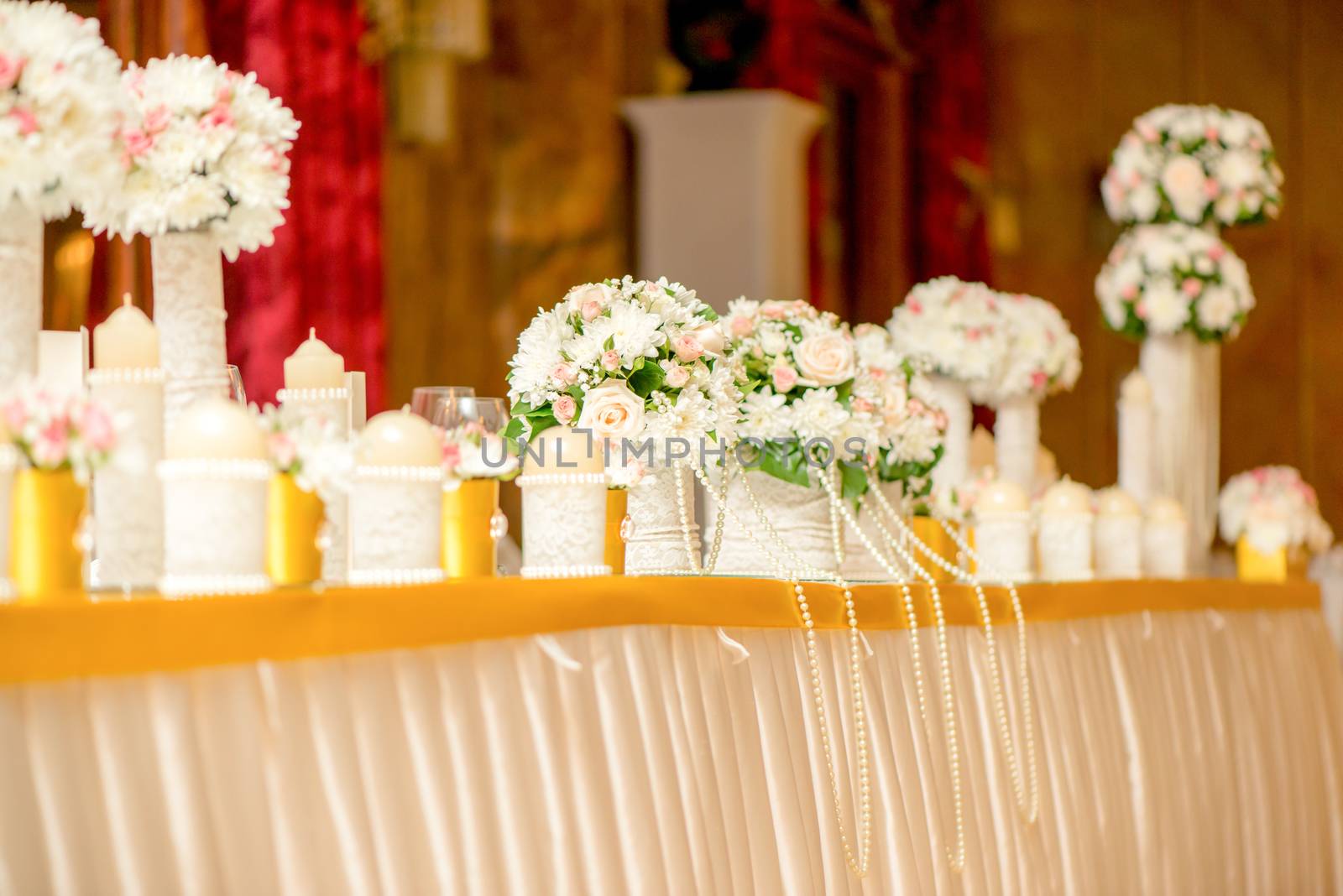 Wedding table decoration with flowers and candle