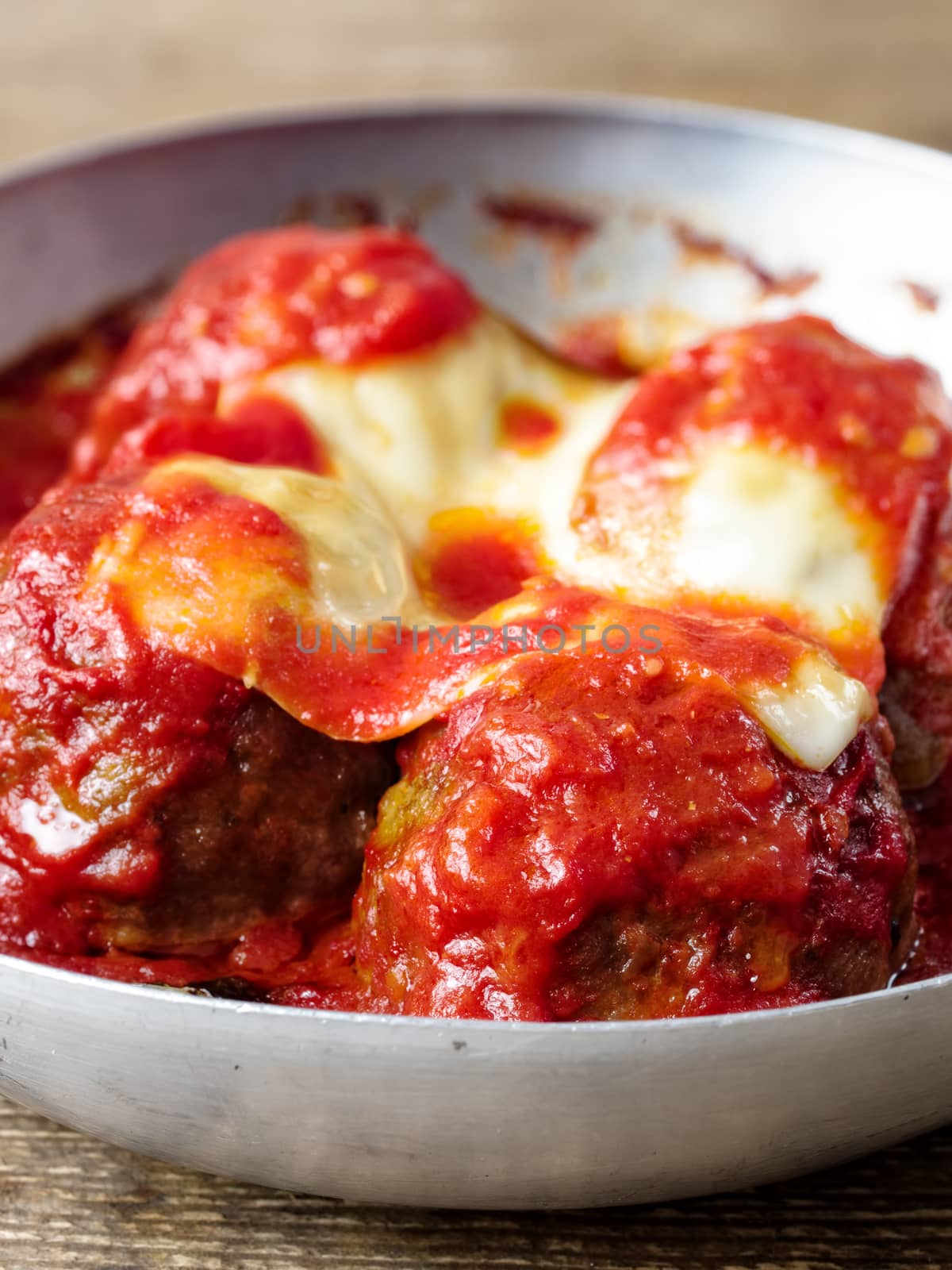 close up of                     traditional classic italian meatball in tomato sauce