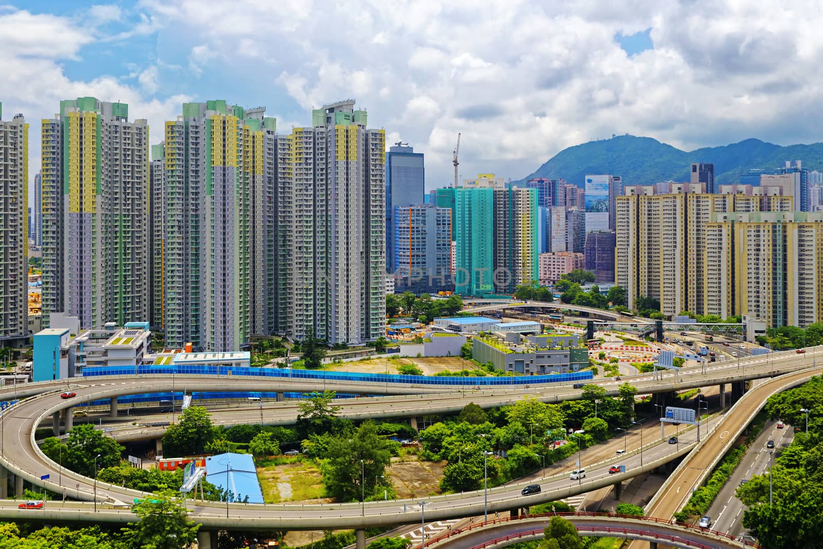 hong kong public estate with landmark lion rock at day