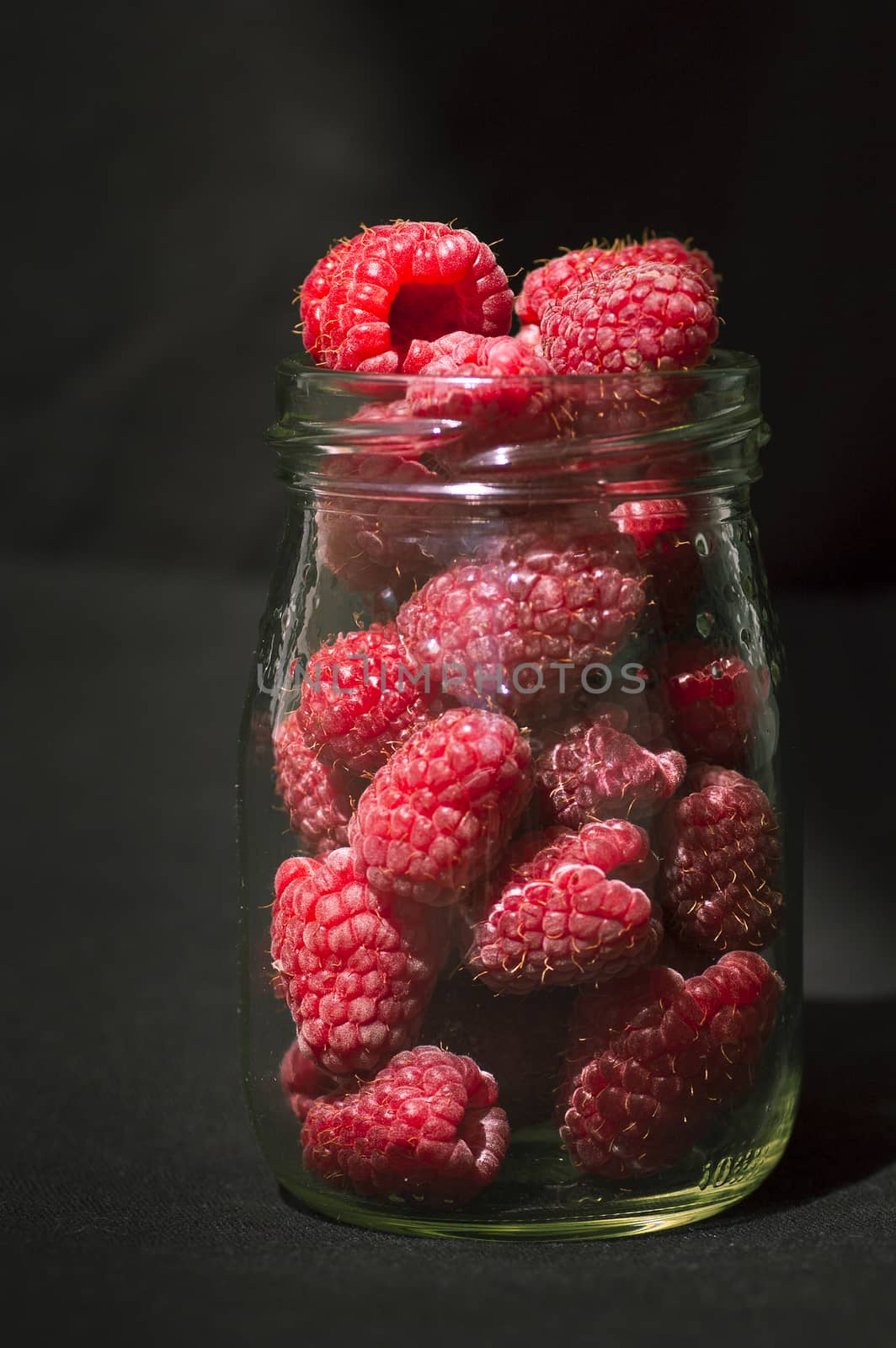 fresh raspberries in glass by Bleshka