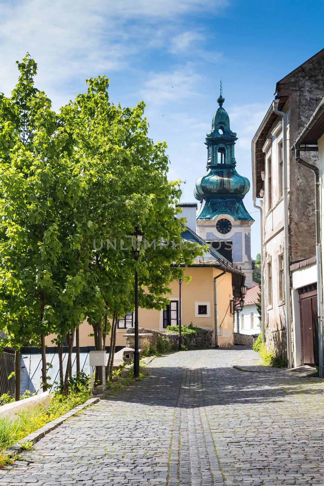 Street with a church, Banska Stiavnica, Slovakia by YassminPhoto