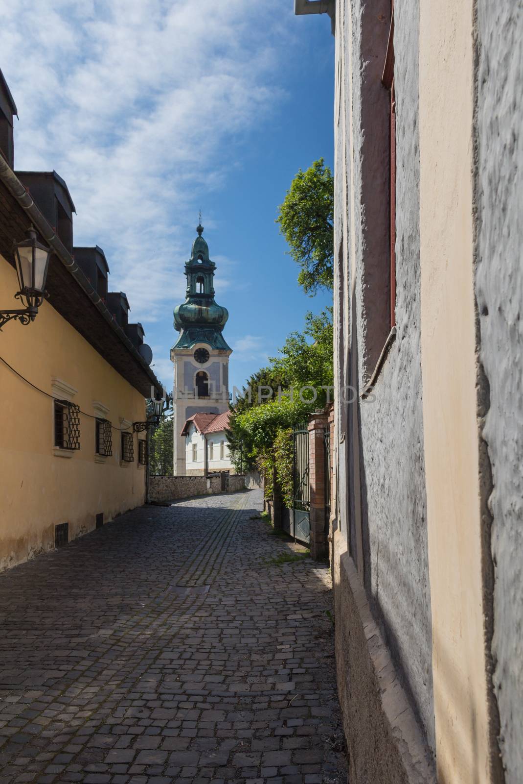 Street with a church, Banska Stiavnica, Slovakia by YassminPhoto