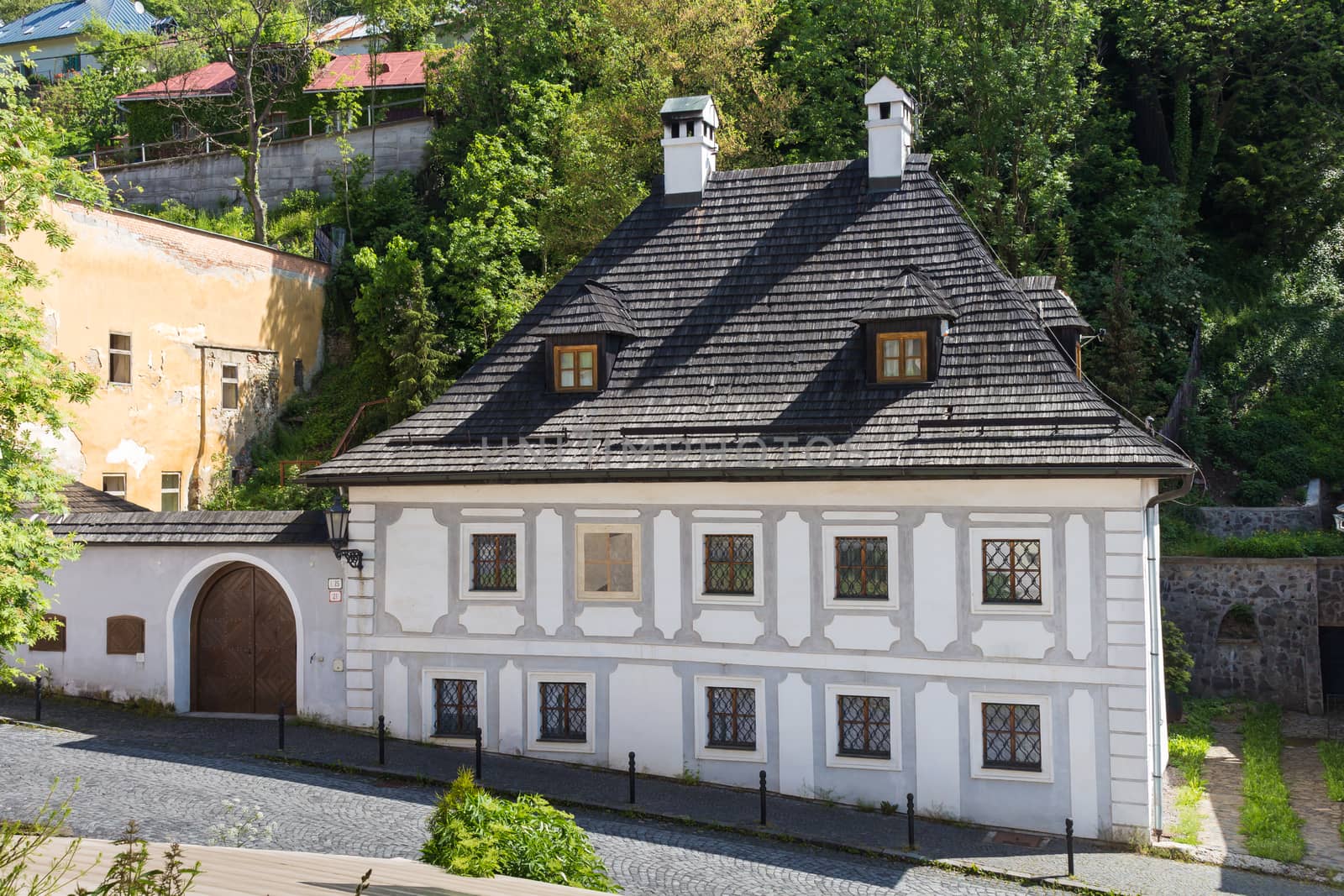 Street in Banska Stiavnica, former mining city, which is in the UNESCO World Heritage list. Calm summer morning.