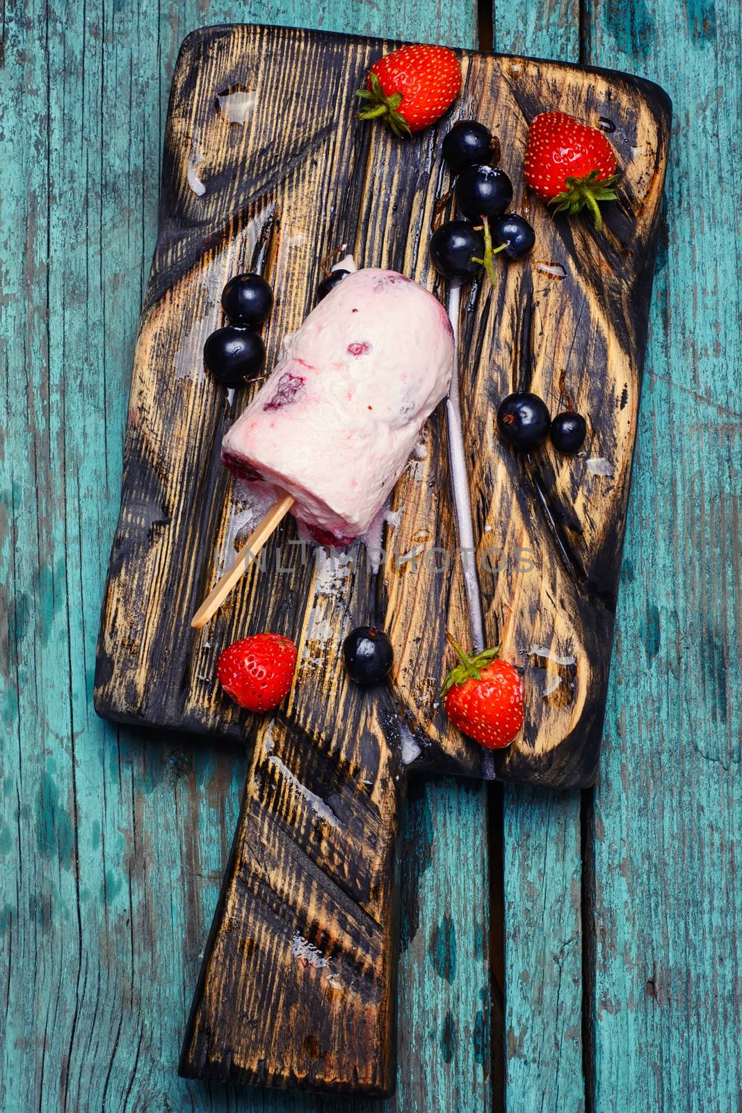 Ice cream on the kitchen chalkboard and berries fresh strawberries