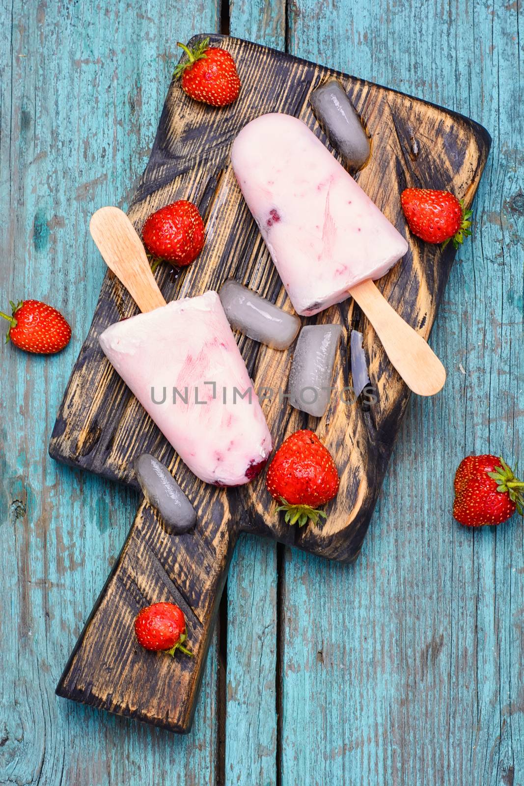 Ice cream on the kitchen chalkboard and berries fresh strawberries