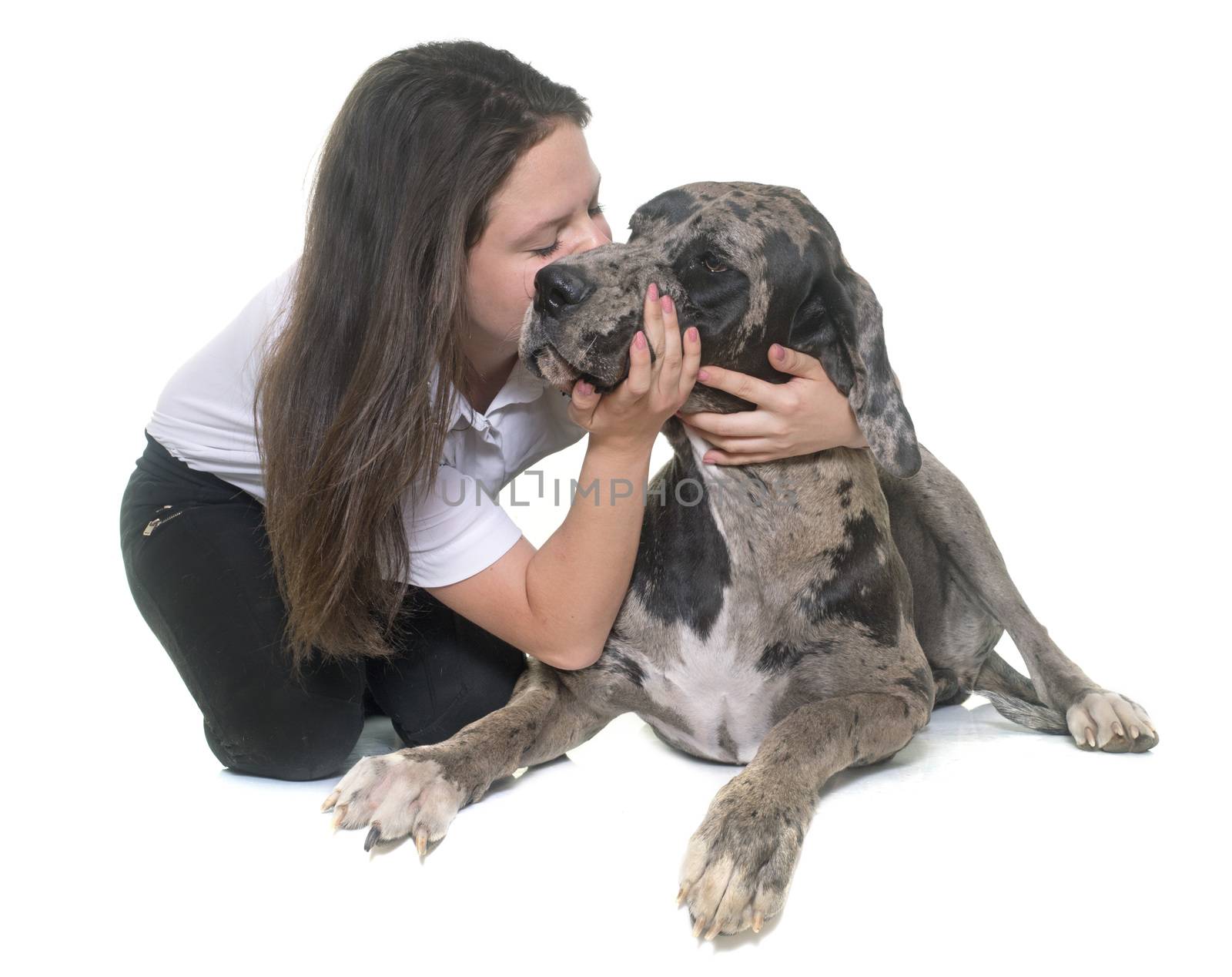 Great Dane and teenager in front of white background