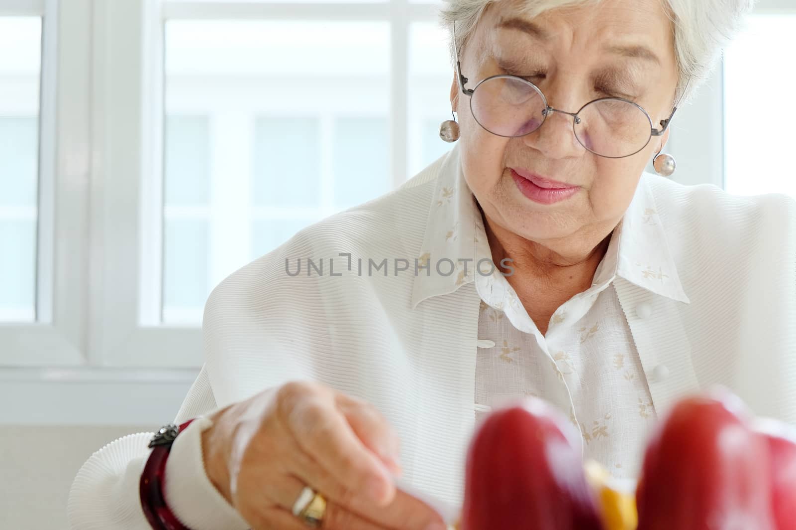 Senior woman reading a book at home,relaxing time