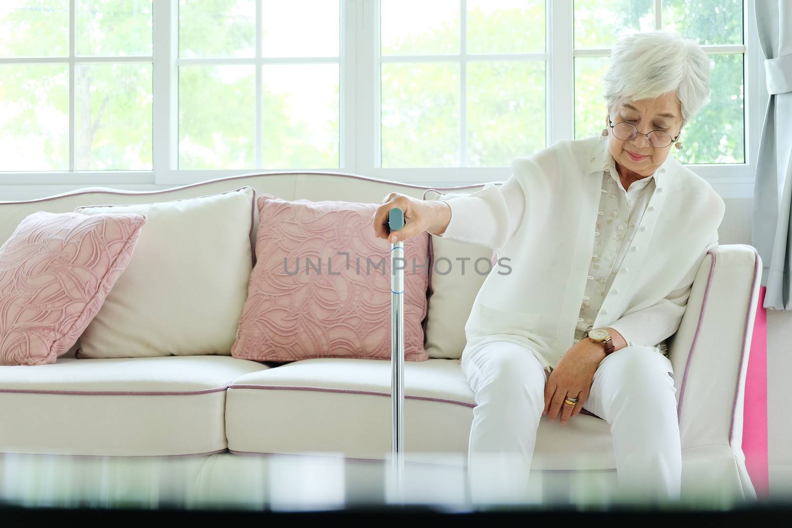 Retired woman with her walking stick