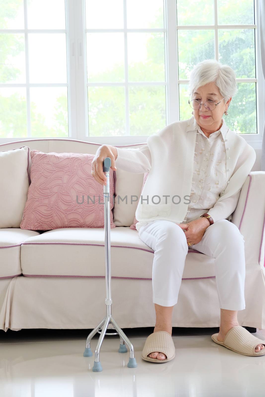 Retired woman with her walking stick