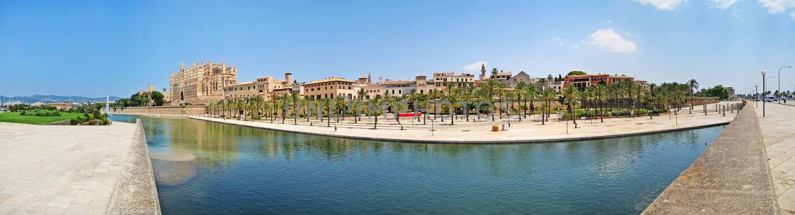 Cathedral La Seu, Palma de Majorca - panorama view from Parc de la Mar, lake in front
