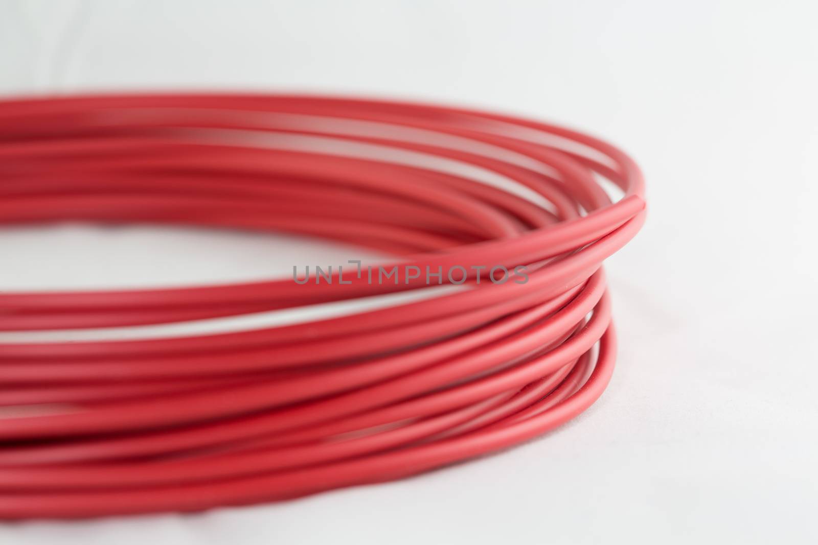 3D printer filament roll in red