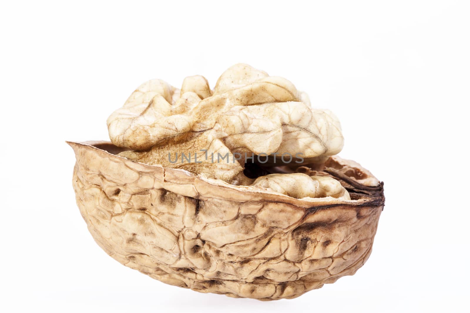 Single  walnut with half nutshell  isolated on white background, close up
