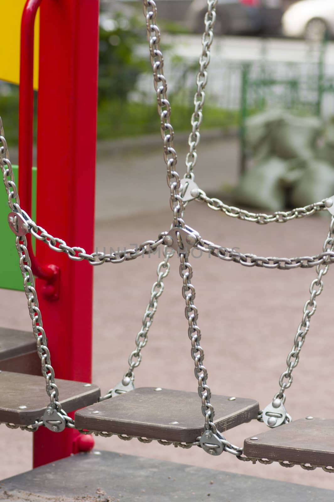 bridge on the chains of the wooden planks on the playground