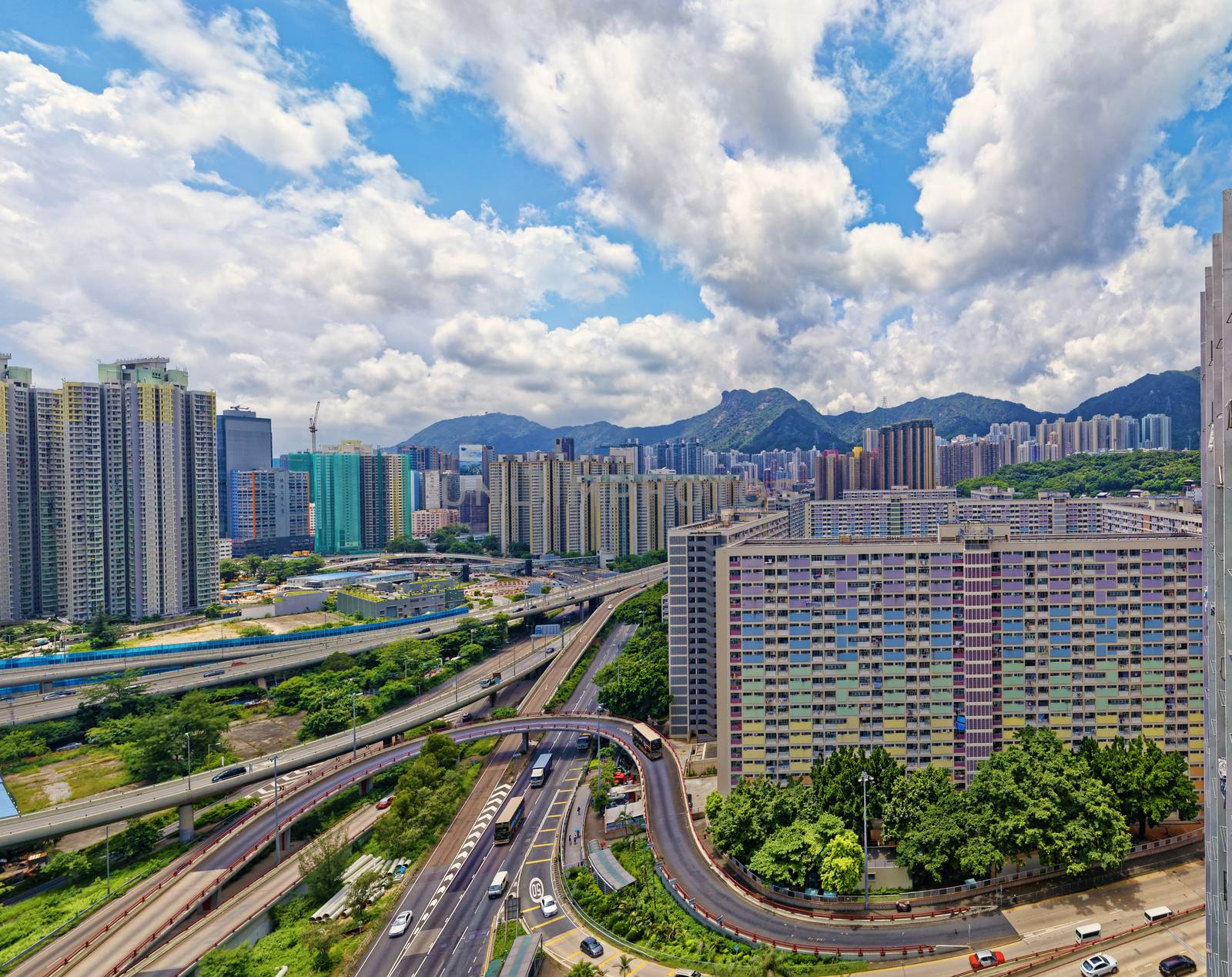 hong kong public estate buildings with landmark lion rock at day