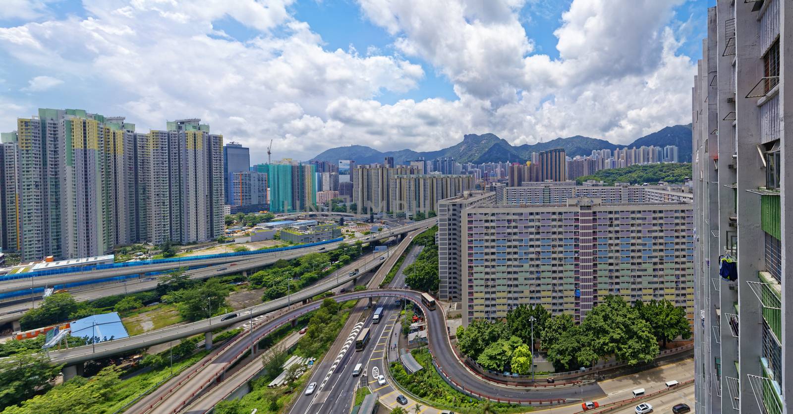 hong kong public estate buildings with landmark lion rock by cozyta