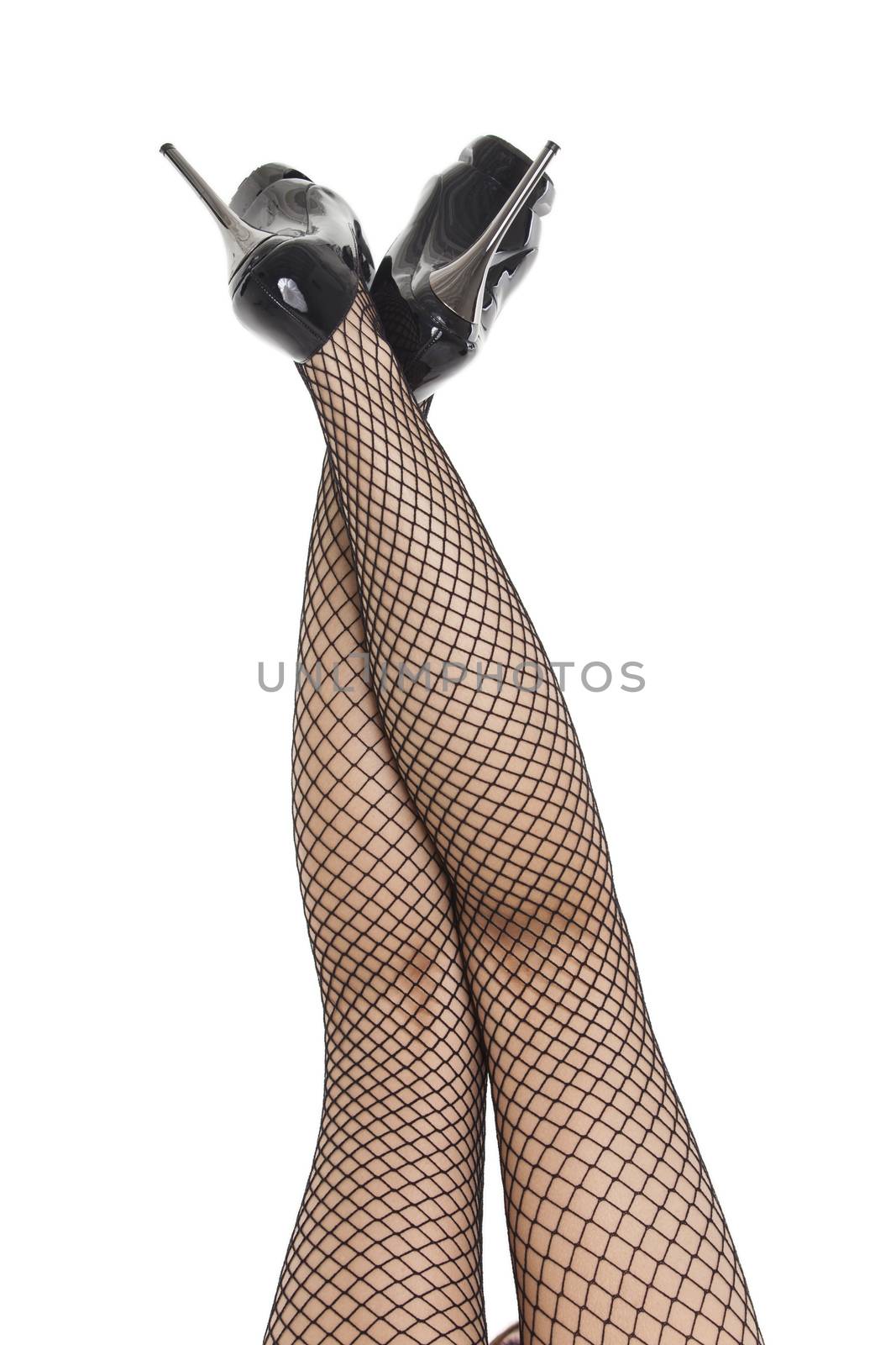 womans feet in fish net stockings