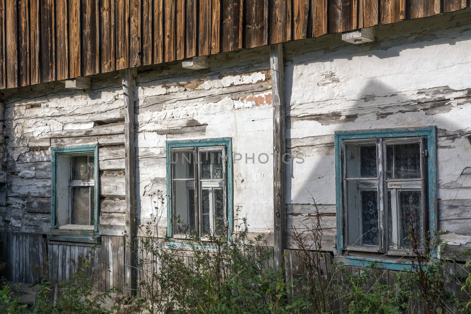 Wooden windows of the old abandoned house