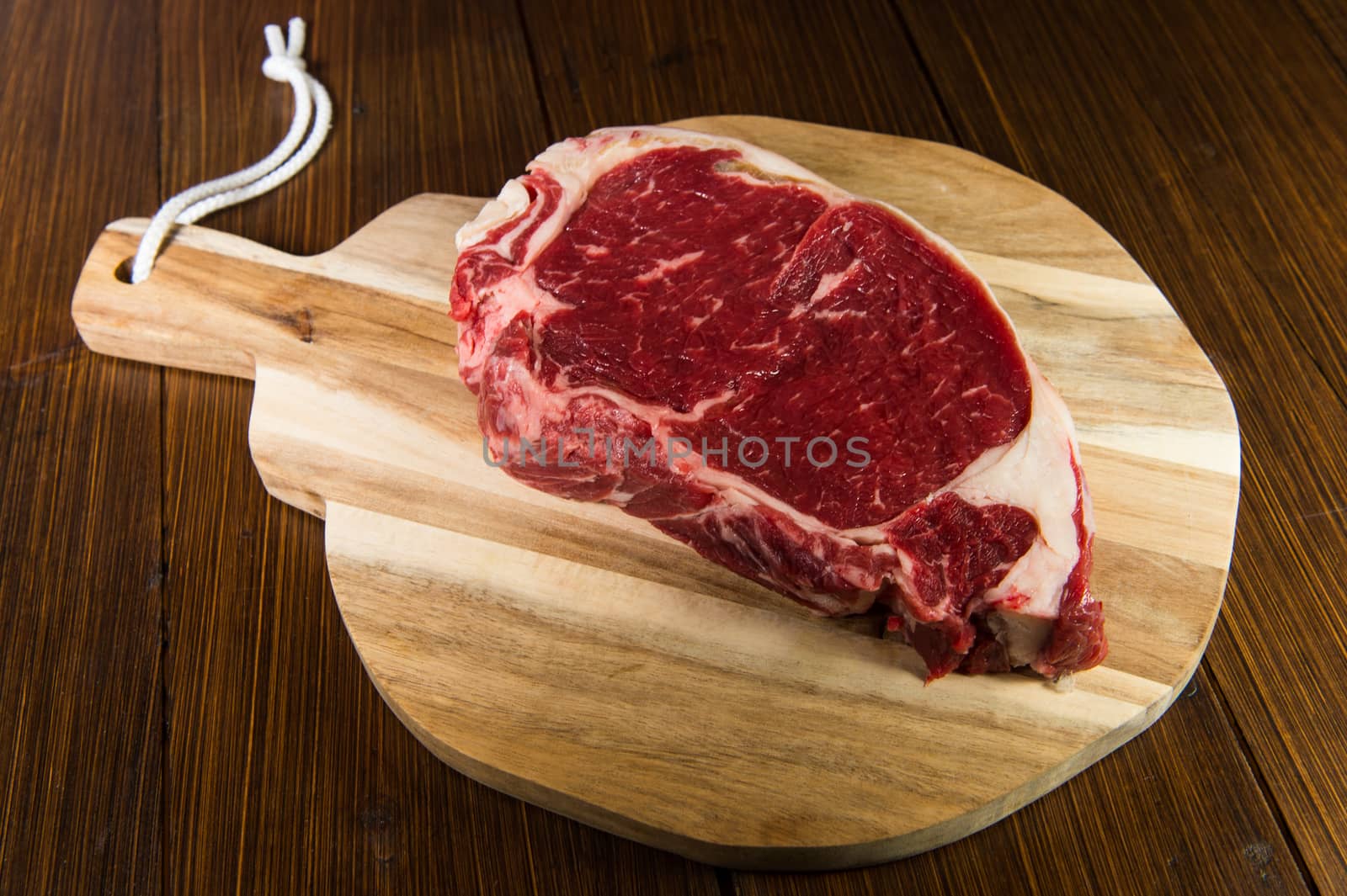 Entrecote steak of beef on a wooden board, studio shoot