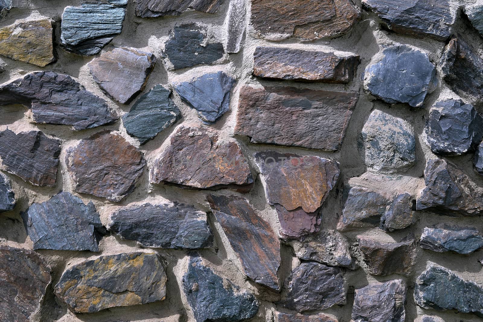 The texture in the form of a wall of colored quartz.