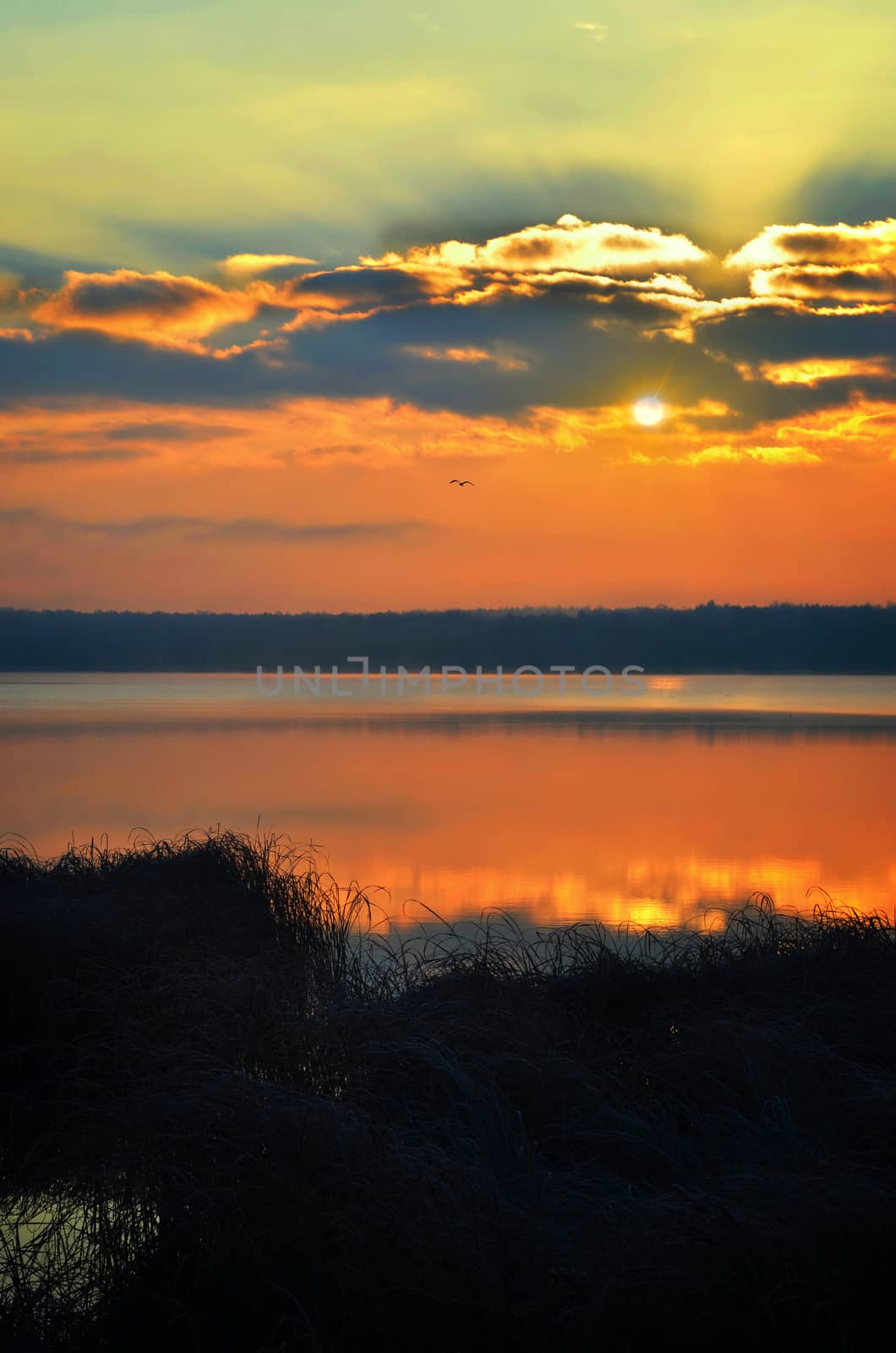 Sunrise over the lake early in the morning with beautiful clouds.