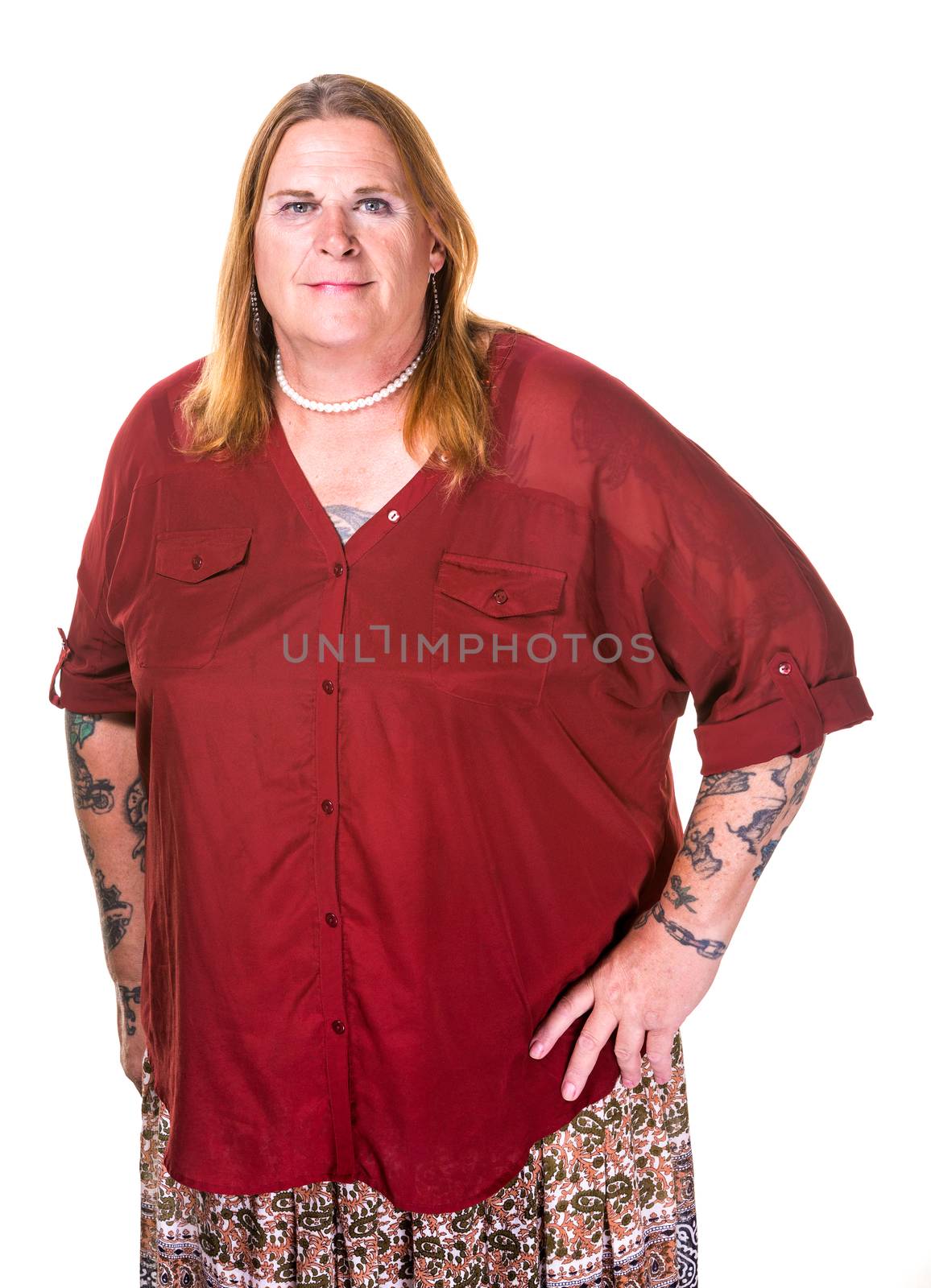 Smiling transgender woman in pearl necklace on white background